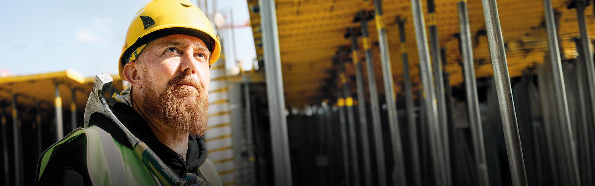 Construction Worker looking at Jobsite