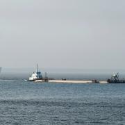 The tunnel sections are floated 320 km downriver to their final location. Photo: Jay Westcott