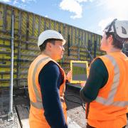 Site manager Christian Häni (left) and BIM manager Stijepan Ljubicic (right) from STRABAG AG check the formwork construction on the 3D model.