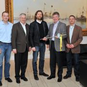 Managing Director Jan Karstens (centre) from building firm Heinrich Karstens GmbH & Co.KG of Kiel was ceremonially presented with the first series-production Monotec tie by Doka Executive Manager Harald Ziebula