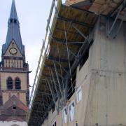 Zwei neue skulptural gestaltete fünfgeschossige Gebäudeflügel bestimmen künftig das Erscheinungsbild der Christuskirche Köln.
<br />
Foto: Doka
