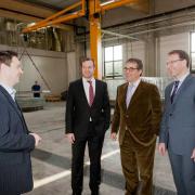 Doka Group CEO Josef Kurzmann and Umdasch Group Executive Board Chairman Dr. Andreas Ludwig being briefed by Christoph Haring (Section Manager Operations, Doka Group) and iLOC -project manager Christian Günther, Head of Operations, Quality Assurance (from r. to l.).